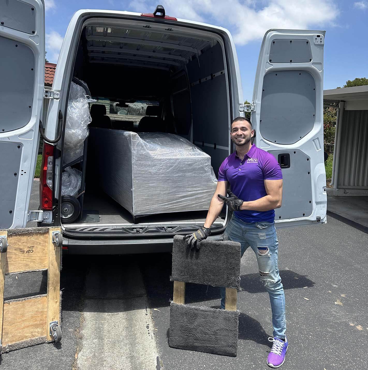 On-the-job image of Rico by van or loading furniture