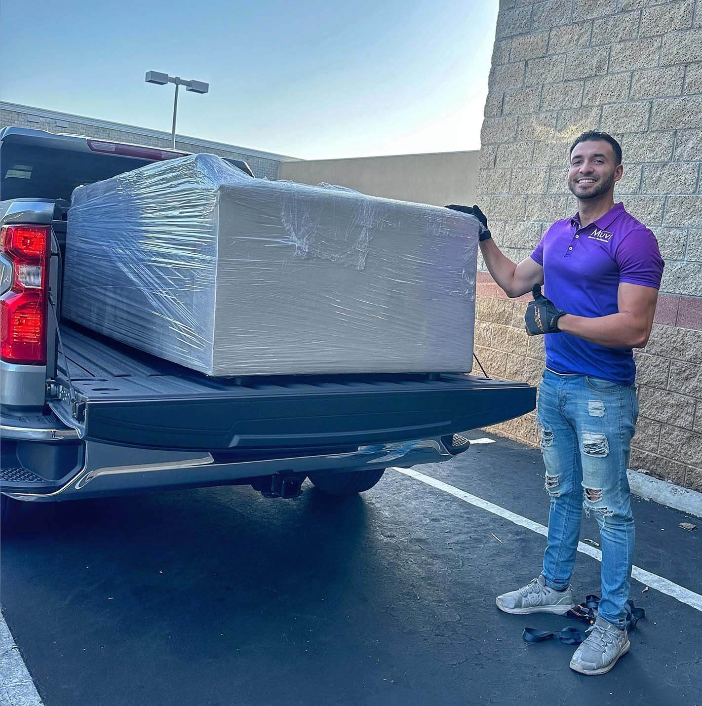 On-the-job image of Rico by van or loading furniture